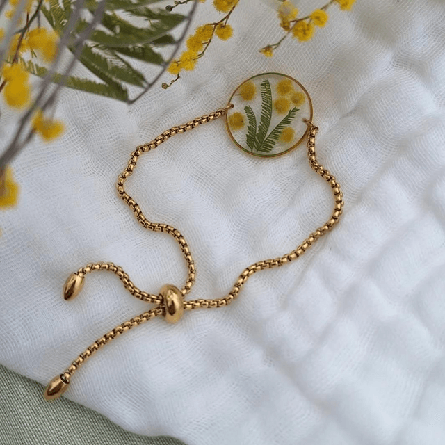 Bracelet coulissant doré · Fleurs de Mimosa